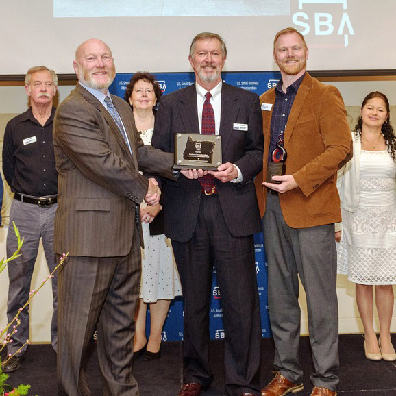 Winners of the 2019 SBDC Excellence and Innovation Award being given their trophies