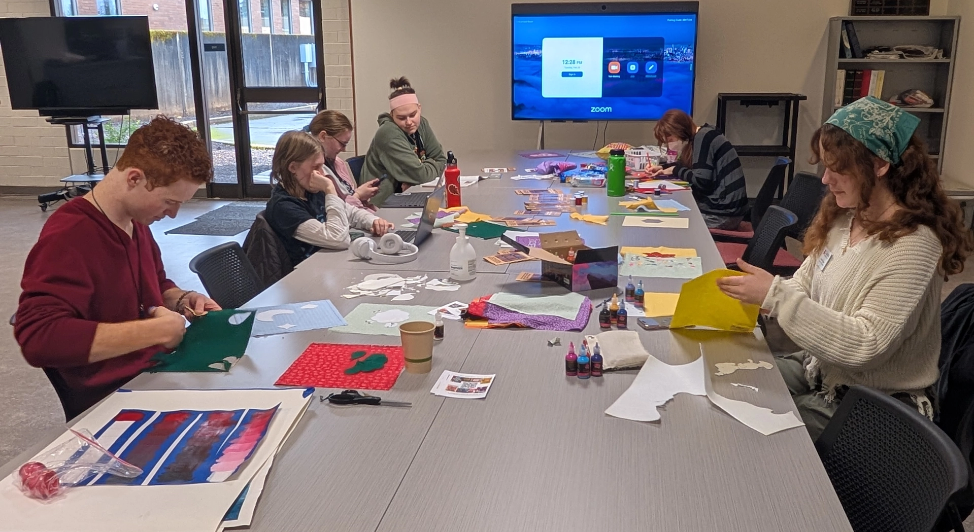 Students at a table working on a project
